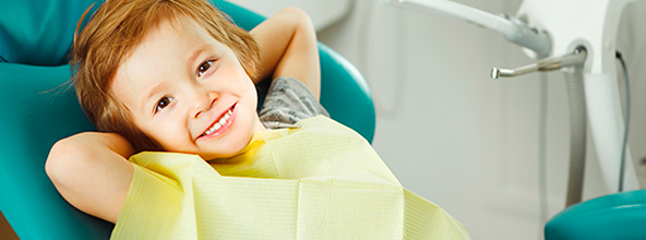 smiling child in dentist chair