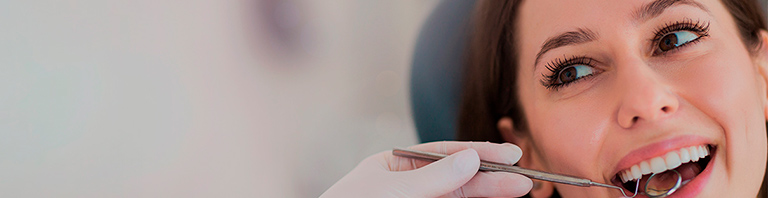 woman in dentist chair smiling